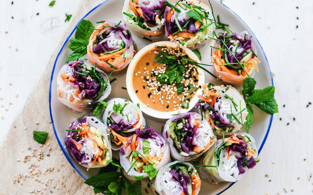 Photo of vegan spring rolls with peanut dipping sauce
